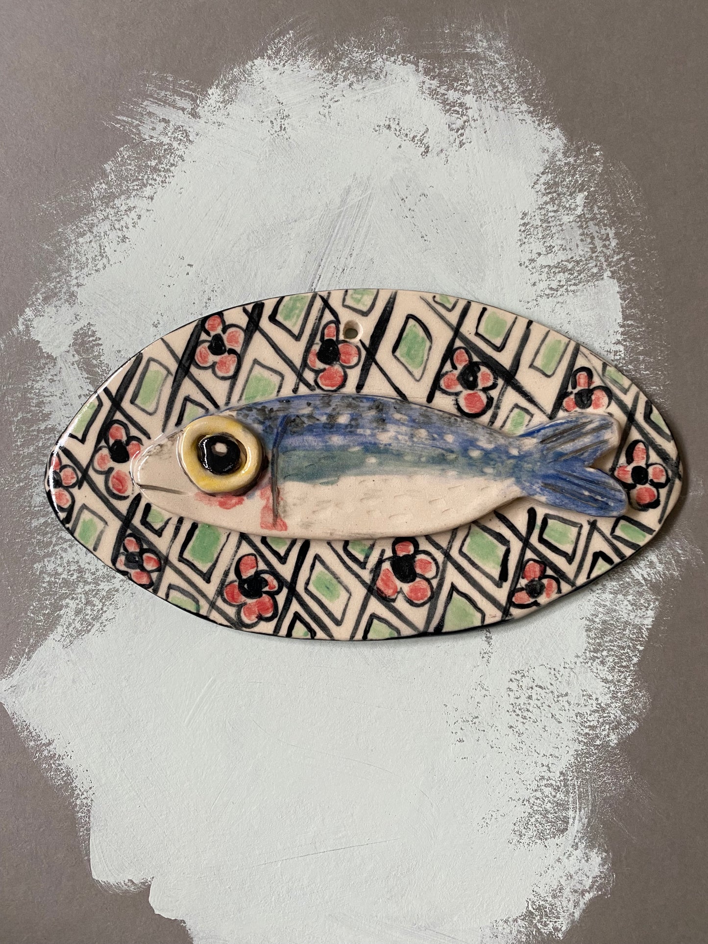 Handcrafted sardines with flowers and circles ceramic tile wall hanging