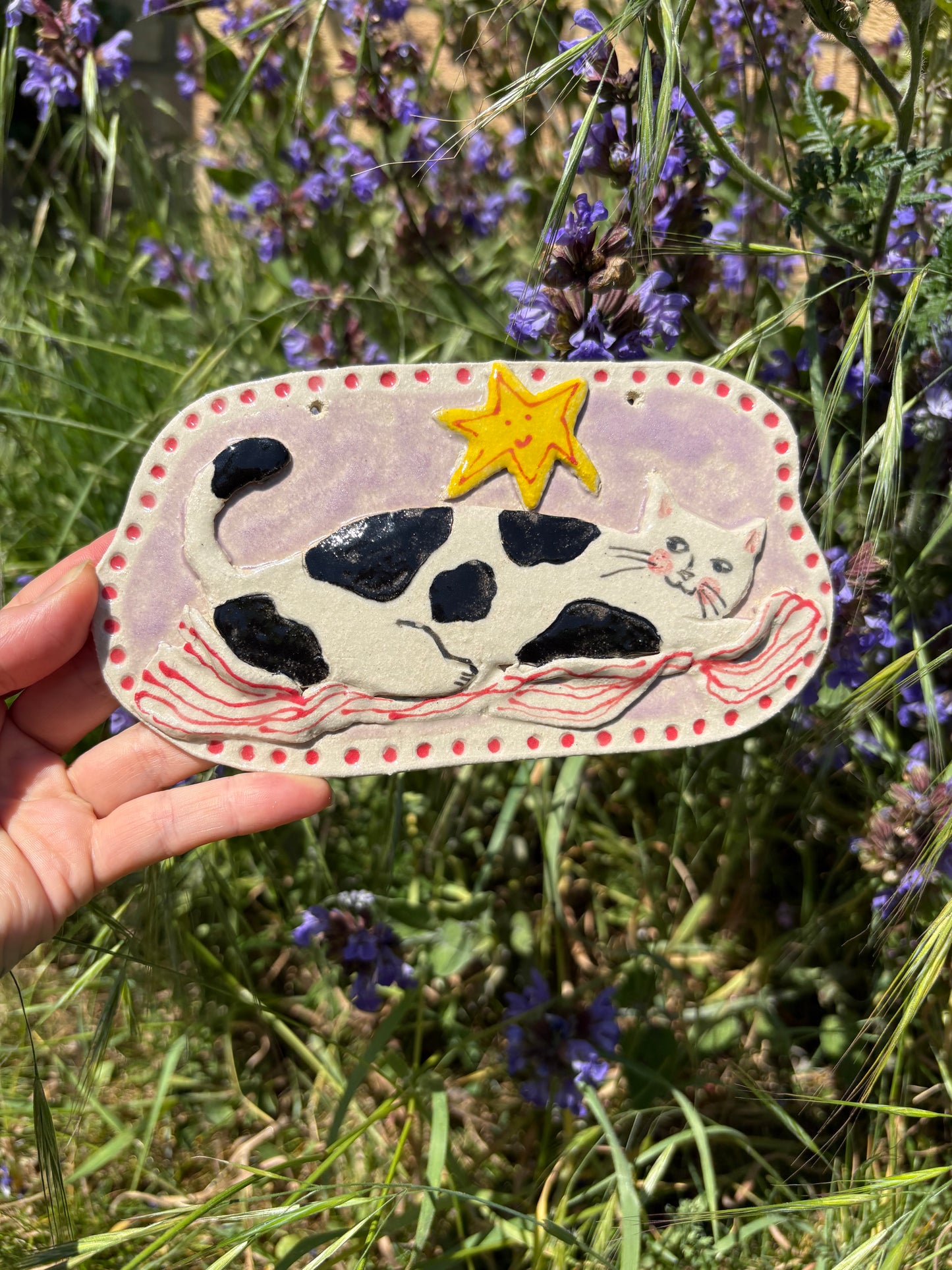 Cozy cat with blanket ceramic hanging tile
