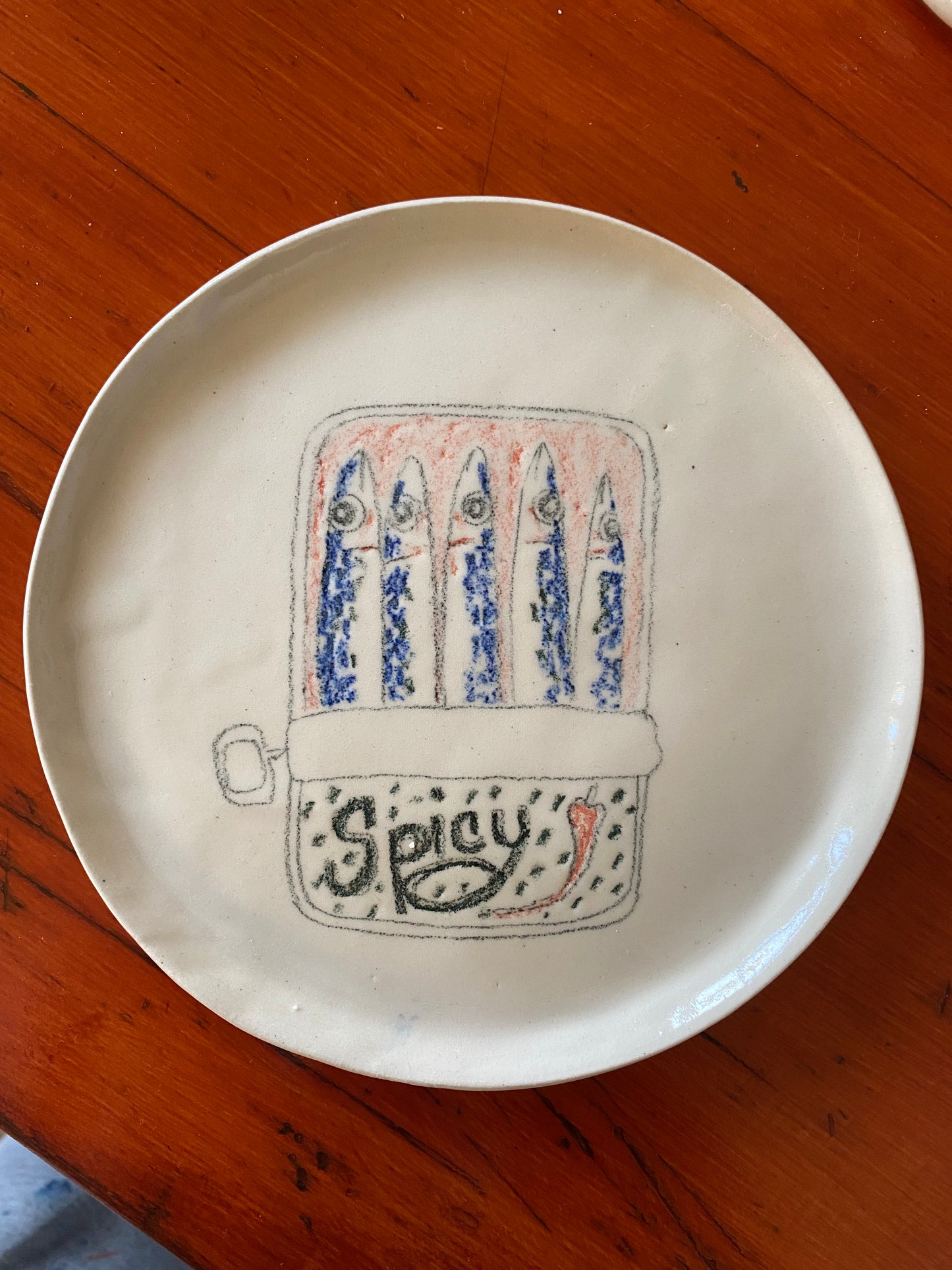 Handmade spicy sardines in tin ceramic plate