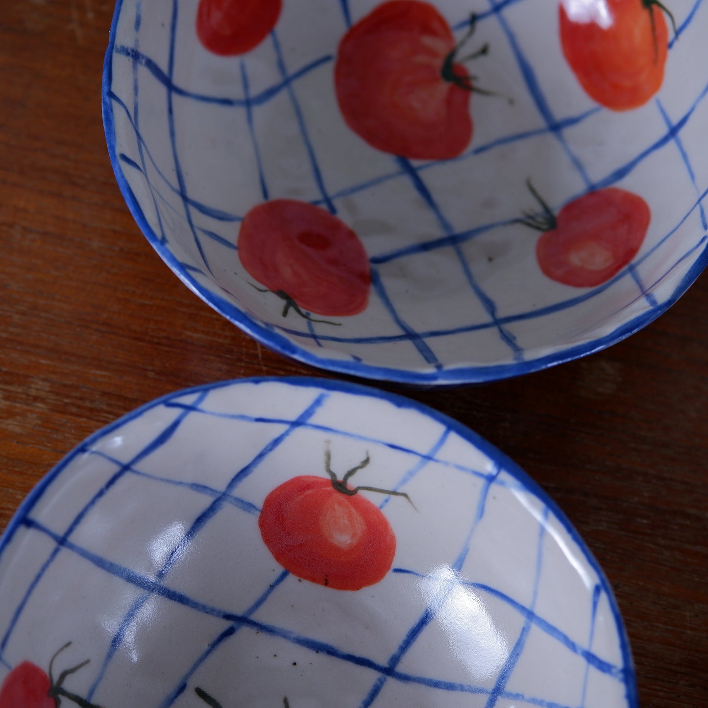 Handmade tomatoes and checks ceramic bowls