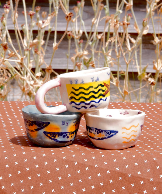 Espresso cups with sardines