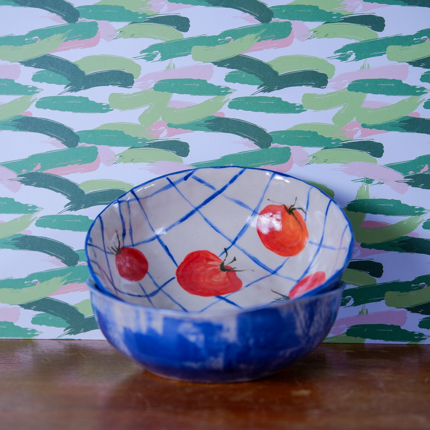 Handmade tomatoes and checks ceramic bowls