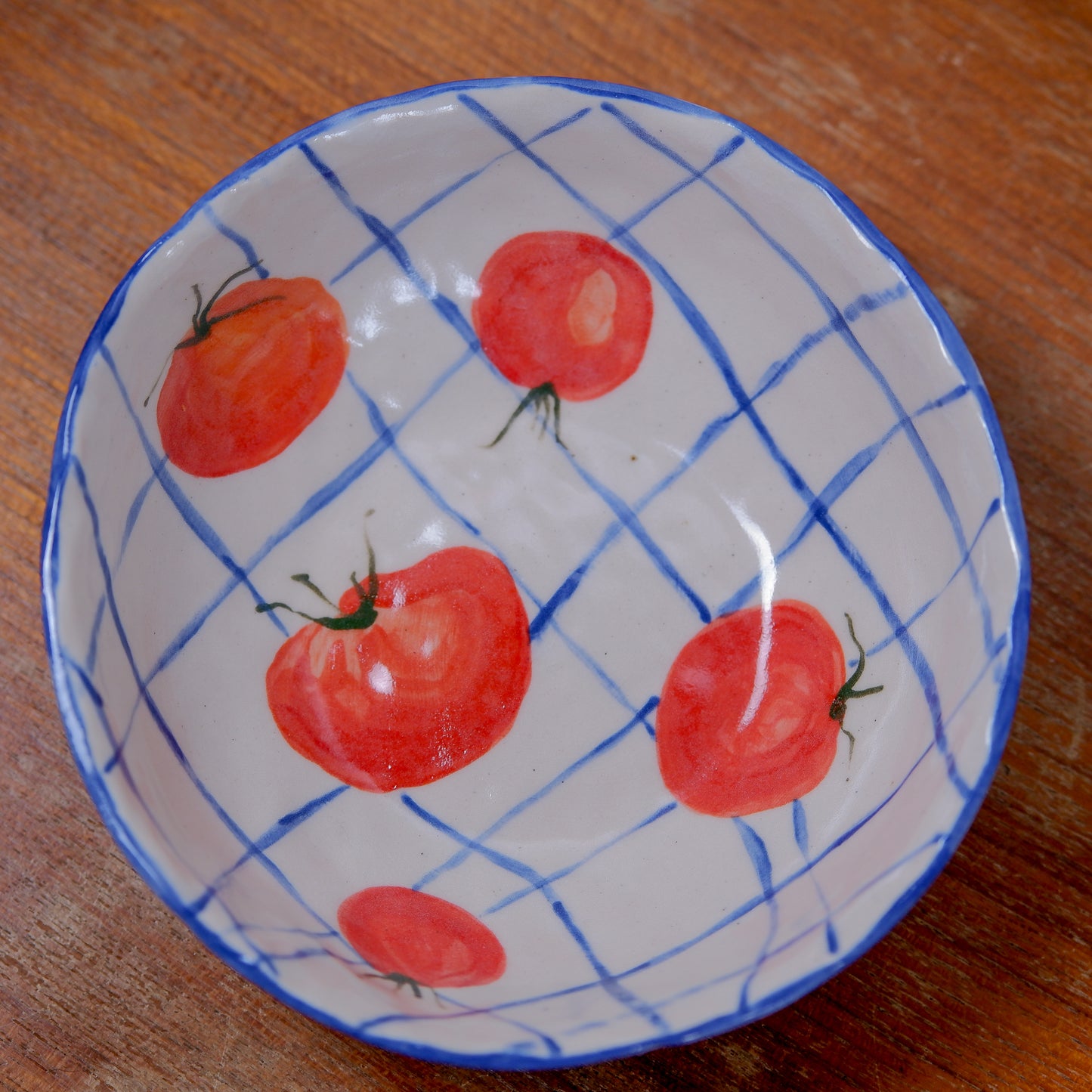 Handmade tomatoes and checks ceramic bowls