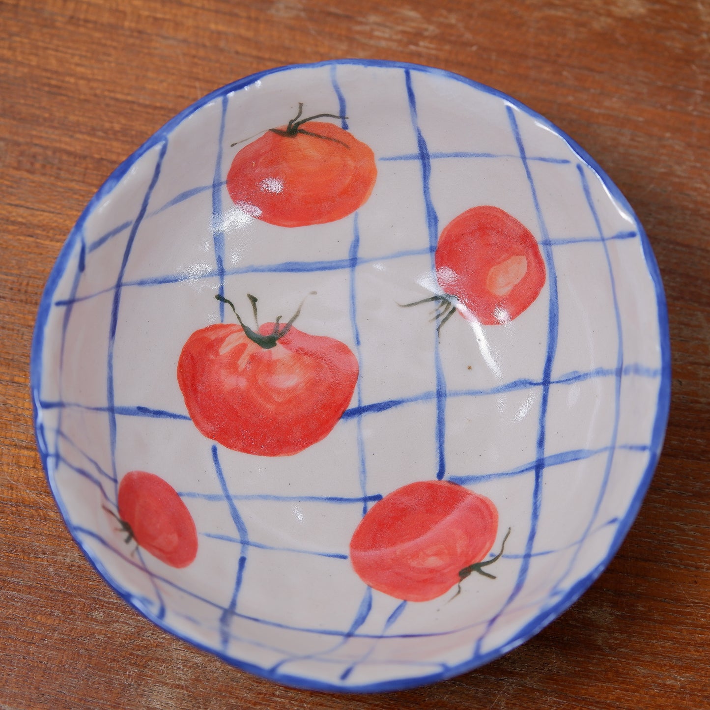 Handmade tomatoes and checks ceramic bowls