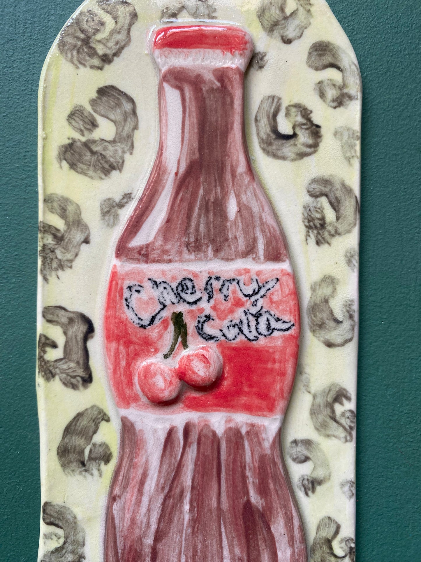 Cherry cola on leopard print ceramic wall hanging tile decor