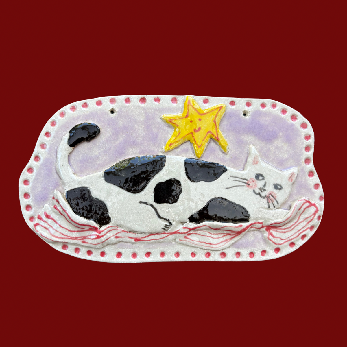 Cozy cat with blanket ceramic hanging tile