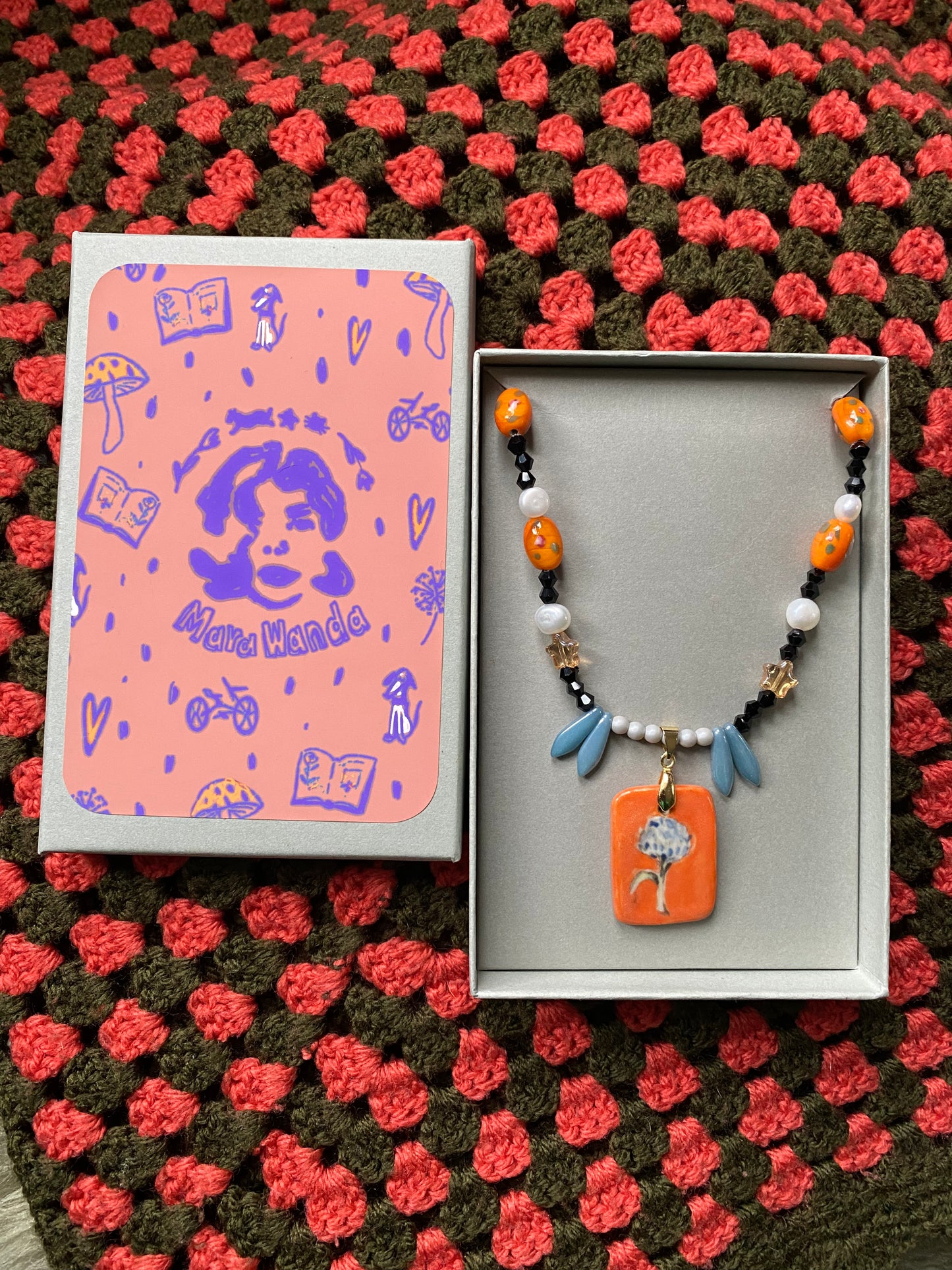 Dandelion orange and blue ceramic charm necklace with freshwater pearls and glass beads